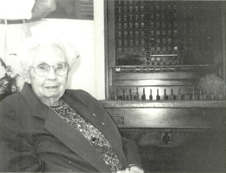 Estelle Fail beside an early switchboard